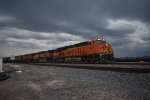 BNSF 6948 brings a eb empty grain train with a bad storm approaching